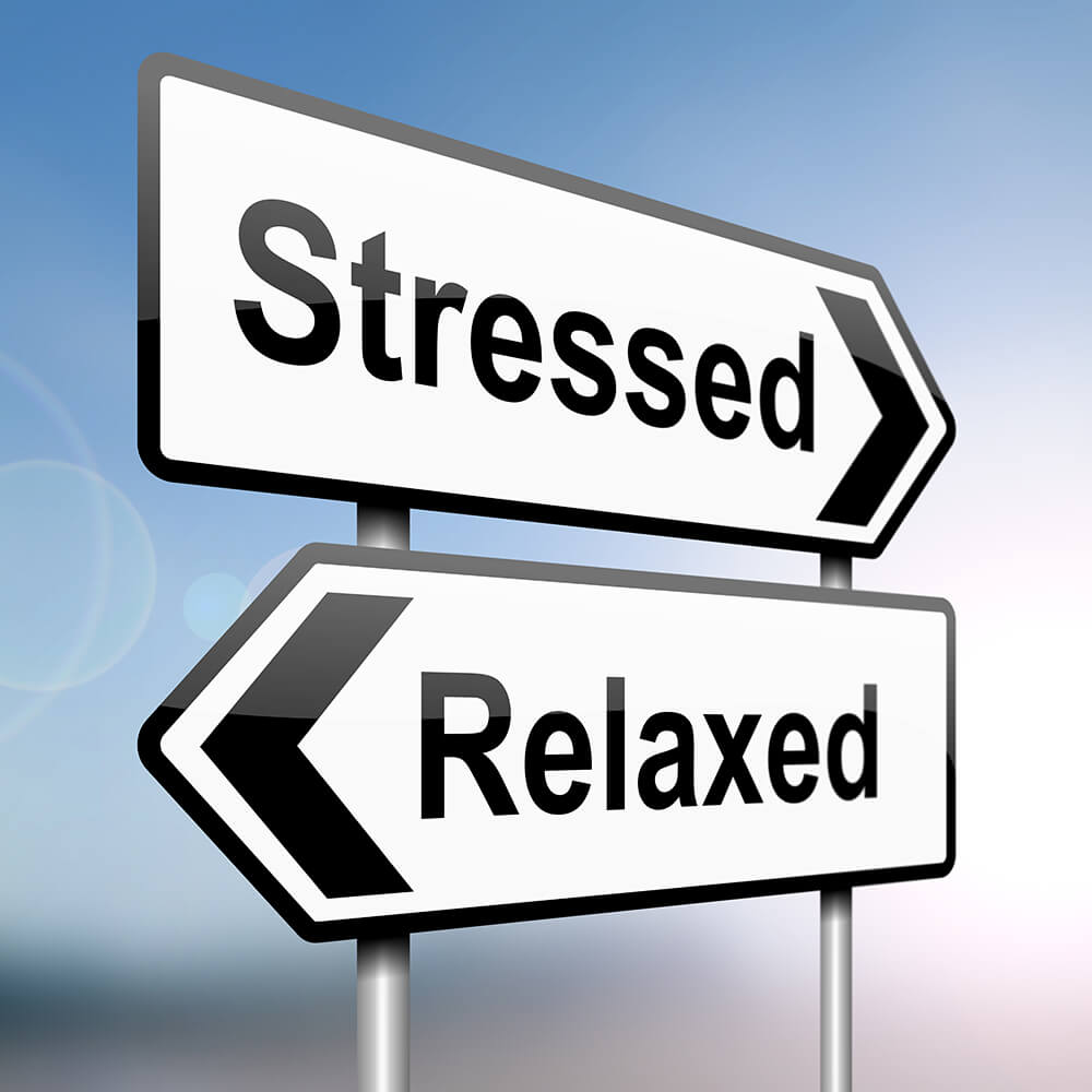 2 sign board that says "stressed" and "relaxed"