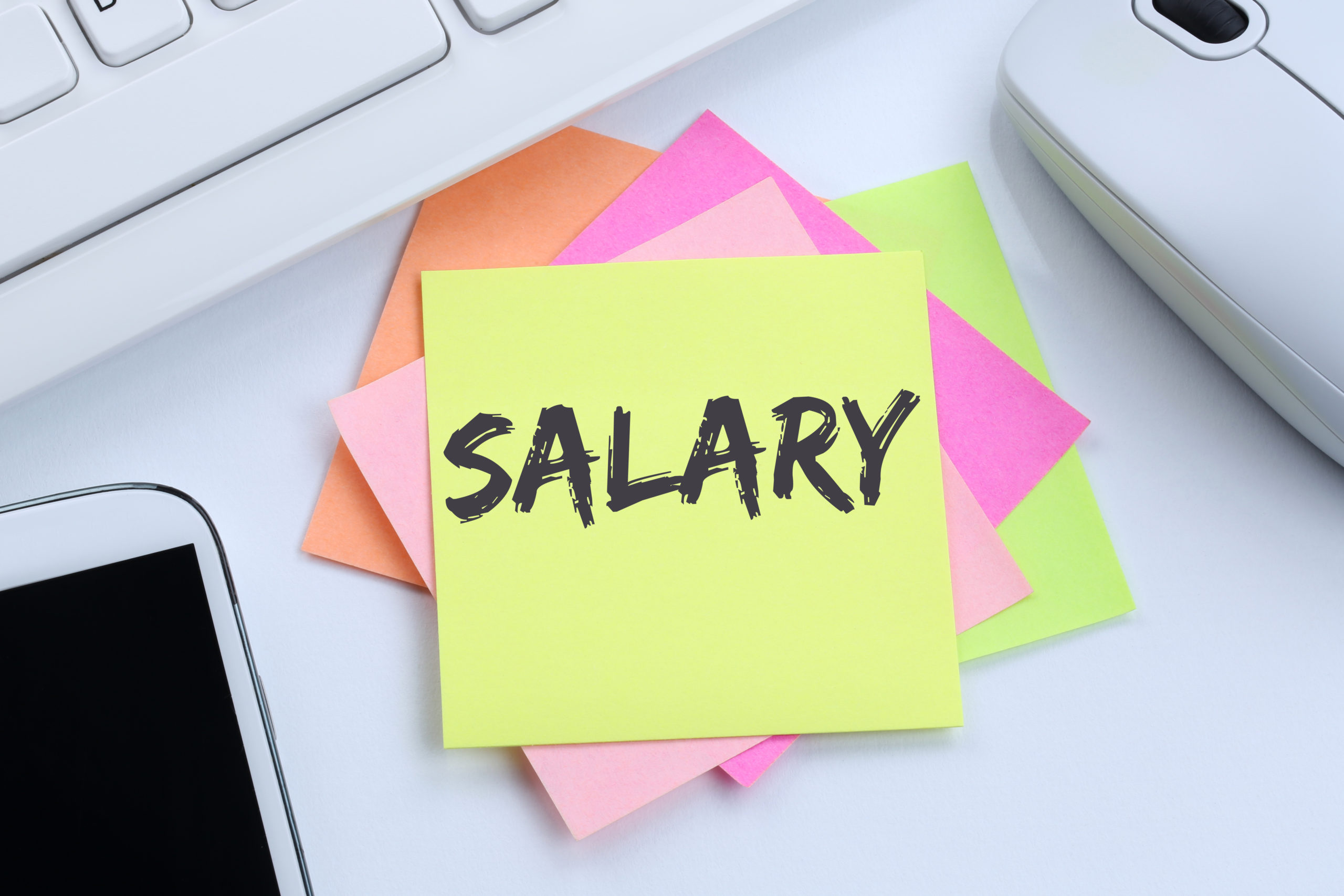 Salary increase negotiation wages money finance business concept desk man headshot